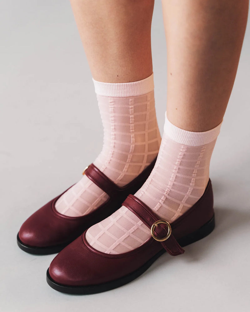 Checkered sheer socks worn with burgundy Mary Jane heels. Rachel Checkered Sheer Socks Ballerina Pink.