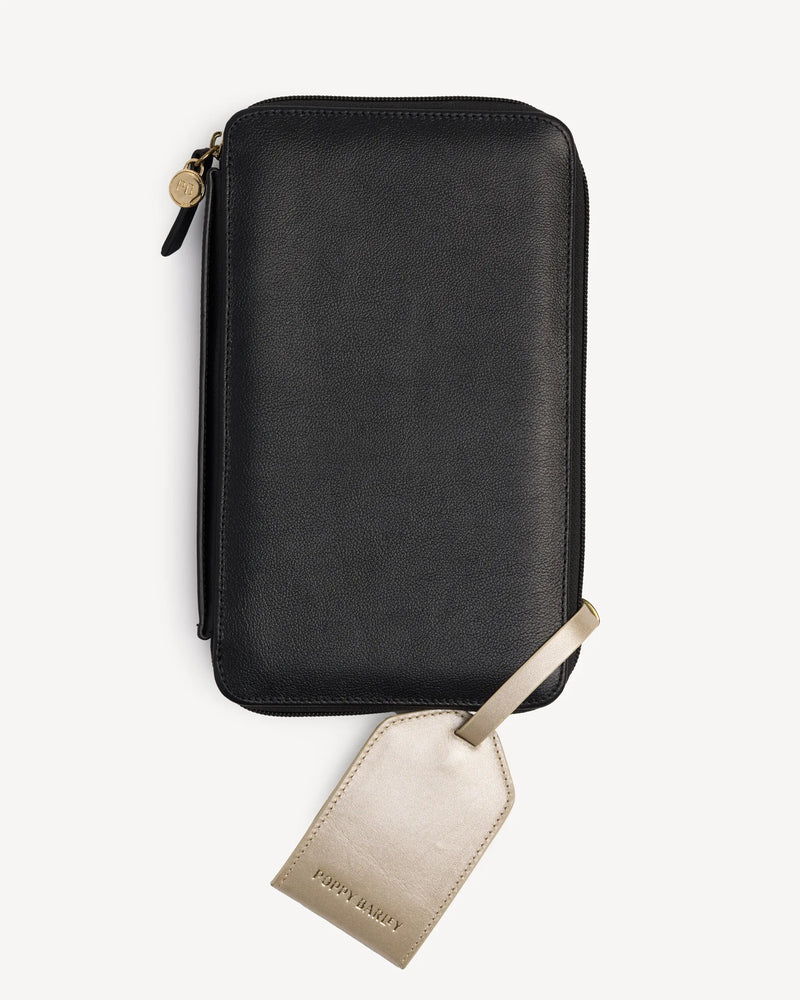 Zip-around passport wallet shown with its attached luggage tag. The Six Person Passport holder & Slim Luggage Tag Set Black.