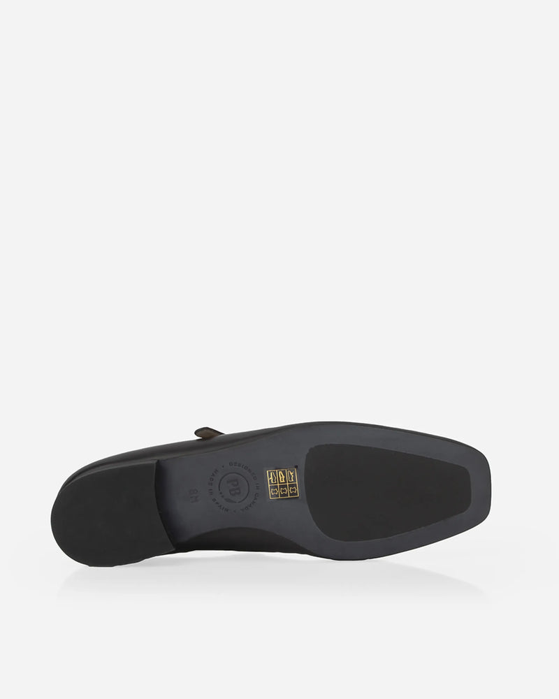 Underside view of the outsole showing the Poppy Barley brand stamp. The Studio Mary Jane Moonflower. Sizes 5–12.