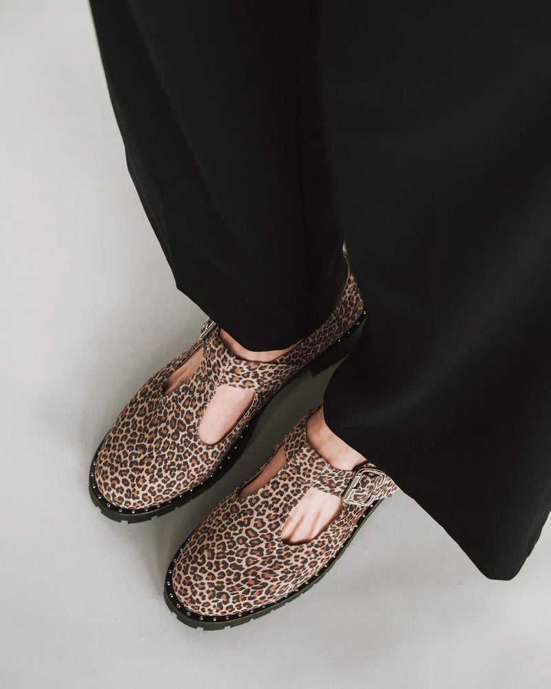 T-bar Mary Jane with studded lug sole, black trousers. The Academy Mary Jane Micro Leopard. Sizes 5–12.