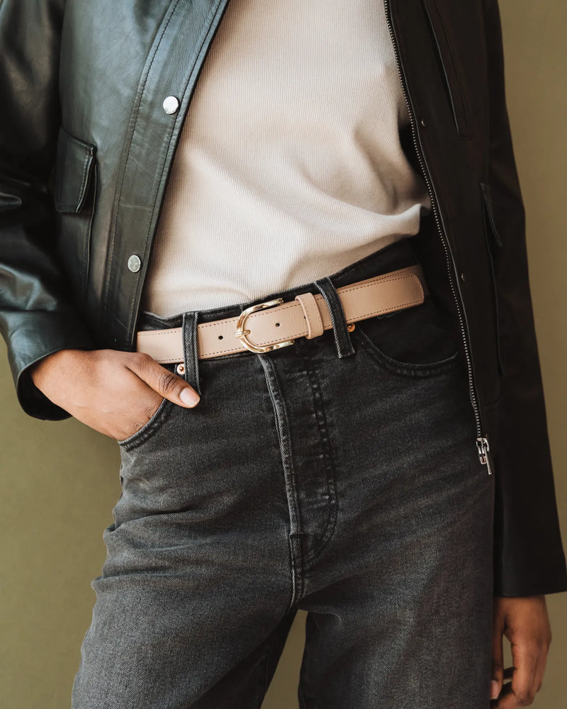 Biscotti leather belt with gold buckle, styled with dark jeans and black leather jacket. The Accent Belt Gold Biscotti.