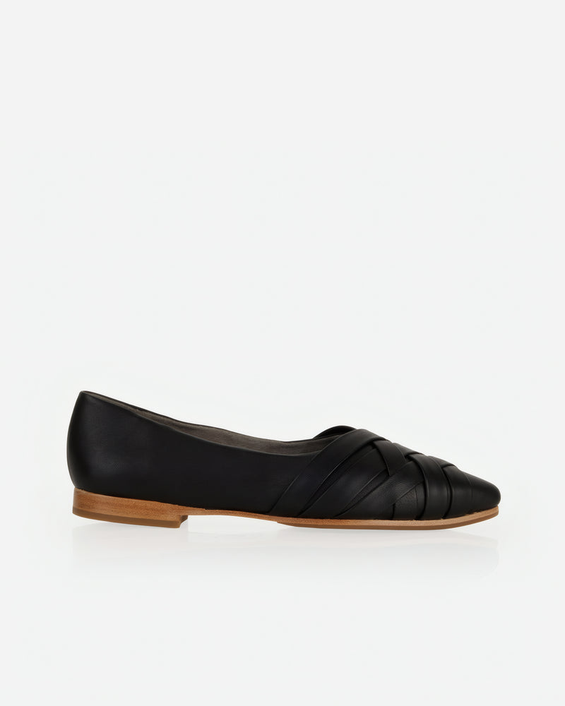Flat lay of The Athena Flat Black in smooth leather. Sizes 5–12