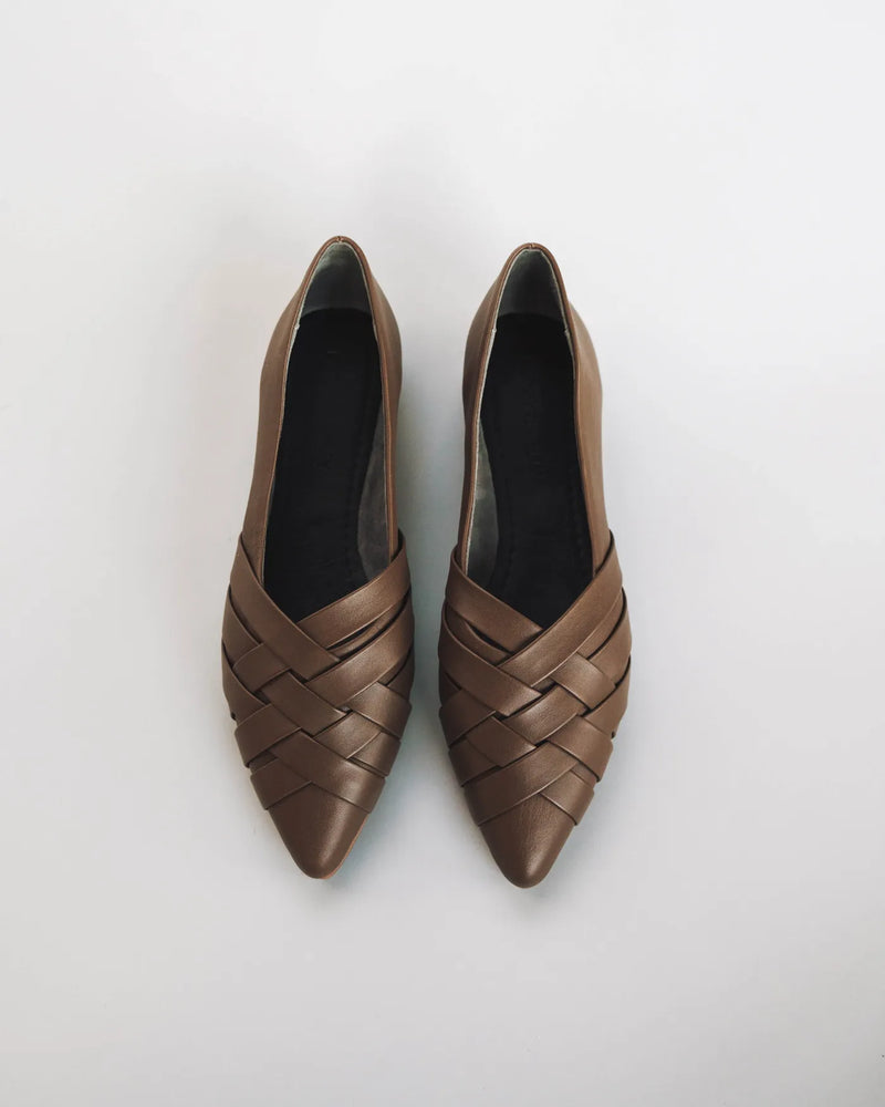 Pair of woven leather pointed-toe flats, overhead view. The Athena Flat Tapenade. Sizes 5–12, available in wide.