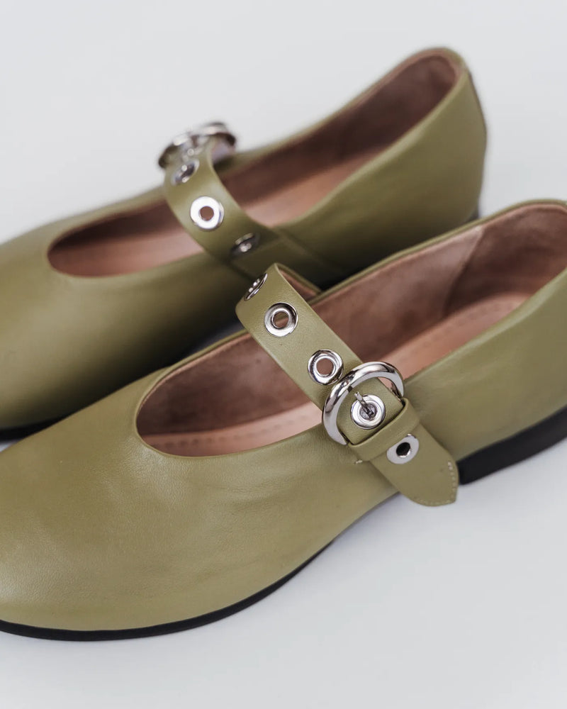 Close-up of leather Mary Jane flats with eyelet strap and silver ring buckle. The BLVD Mary Jane Matcha. Sizes 5–12.