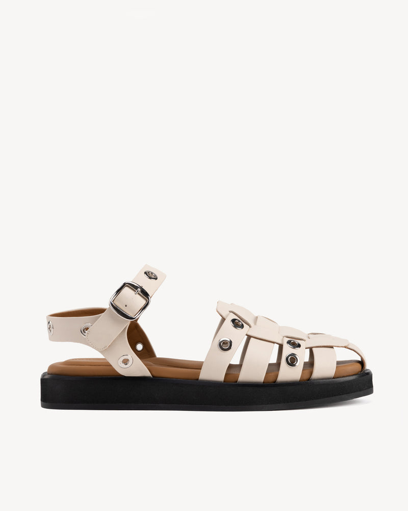 Side view of The Beachcomber Sandal Oat Milk and Silver in White, Neutral smooth leather. Sizes 5–12