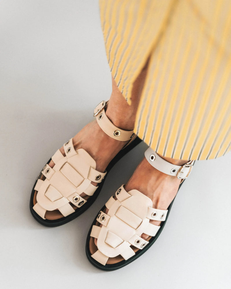 Oat milk and silver cage sandals with ankle strap, overhead view. The Beachcomber Sandal Oat Milk and Silver. Sizes 5–12.