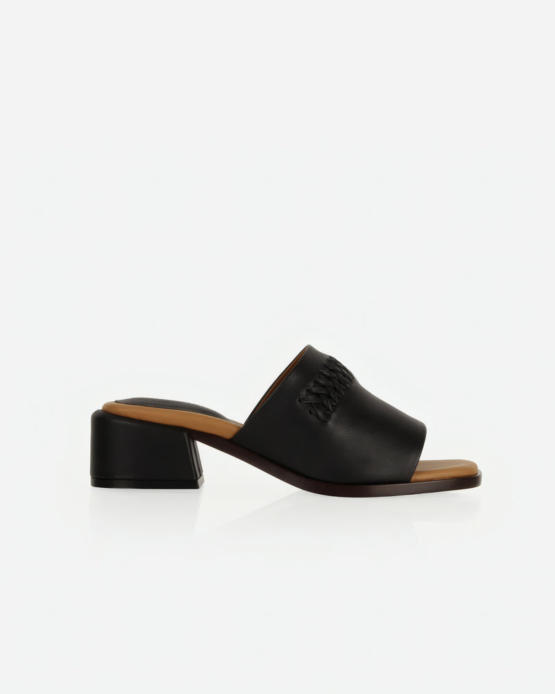 Heel detail of The Bohème Heeled Sandal Black in smooth leather. Sizes 5–12