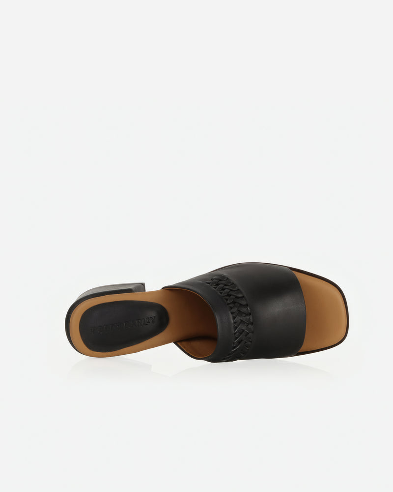 Heel detail of The Bohème Heeled Sandal Black in smooth leather. Sizes 5–12
