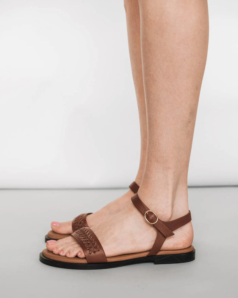 Woven leather sandals with ankle strap, side view. The Bohème Sandal Hazelnut. Sizes 5–12.