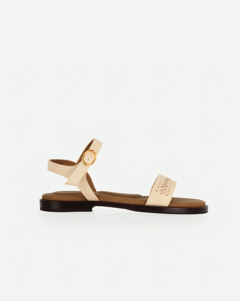 Side view of The Bohème Sandal Oat Milk in White smooth leather. Sizes 5–12