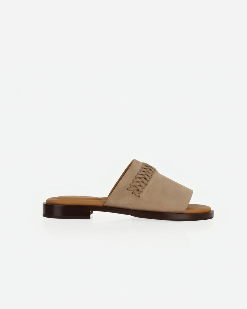 Side view of The Bohème Slide Clay in Neutral, Brown nubuck. Sizes 5–12