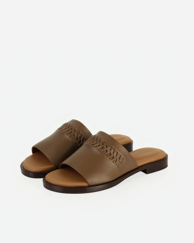Pair of The Bohème Slide Tapenade in Green, Brown smooth leather. Sizes 5–12, wide available