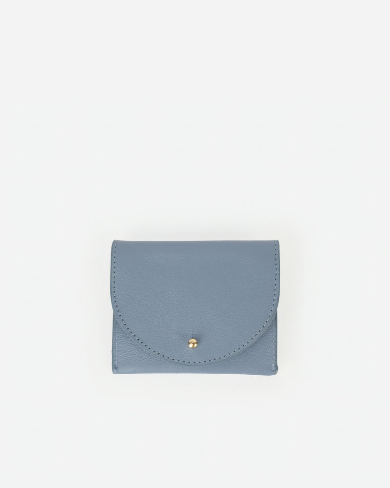 Front view of The Cardholder Faded Denim Micro Pebble in Blue leather