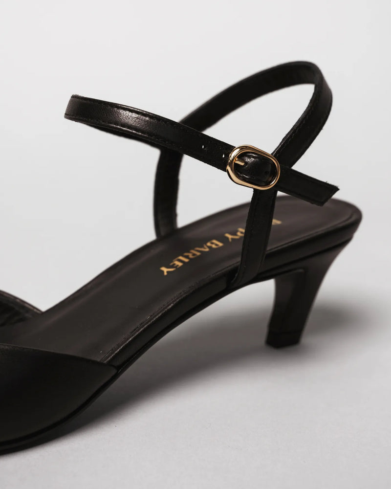 Close-up of black kitten heel sandal showing gold buckle strap. The Claire Kitten Heel Black. Sizes 5–12, available in wide.