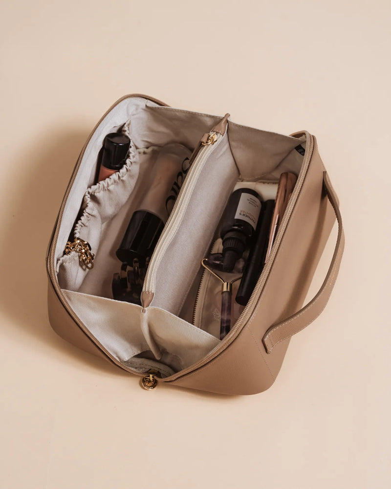 Large leather cosmetic case open with two canvas compartments for makeup. The Cosmetic Case Large Biscotti.