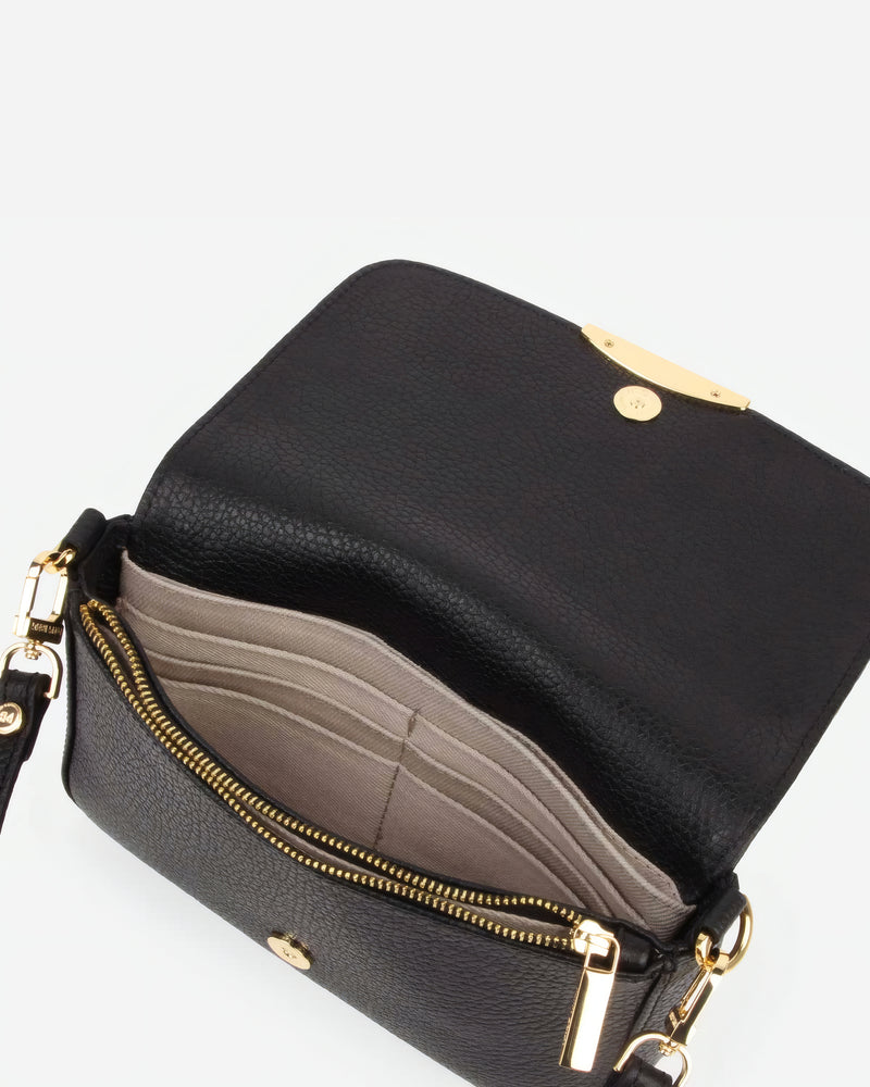 Side view of The Day To Night Bag Resort Red in Red pebbled leather