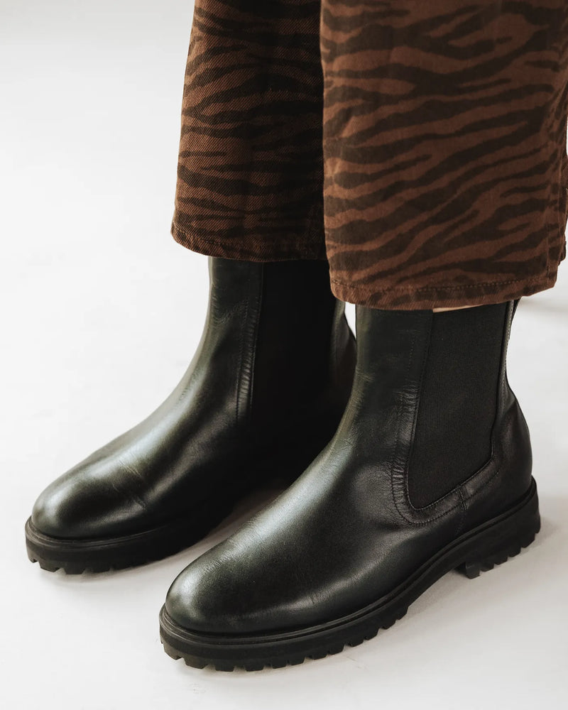 Black leather lug-sole Chelsea boots. The Every Way Chelsea Boot Black Water Resistant. Sizes 5–12, available in wide.