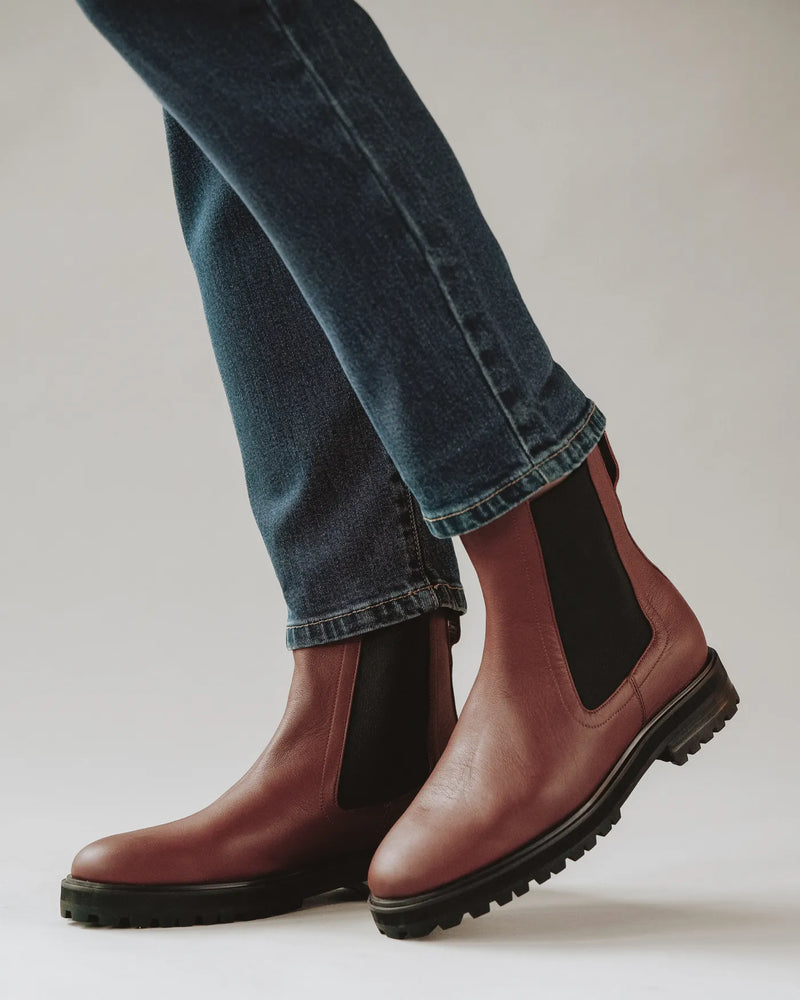Woman wearing leather Chelsea boots with dark jeans. The Every Way Chelsea Boot Redwood. Sizes 5–12.