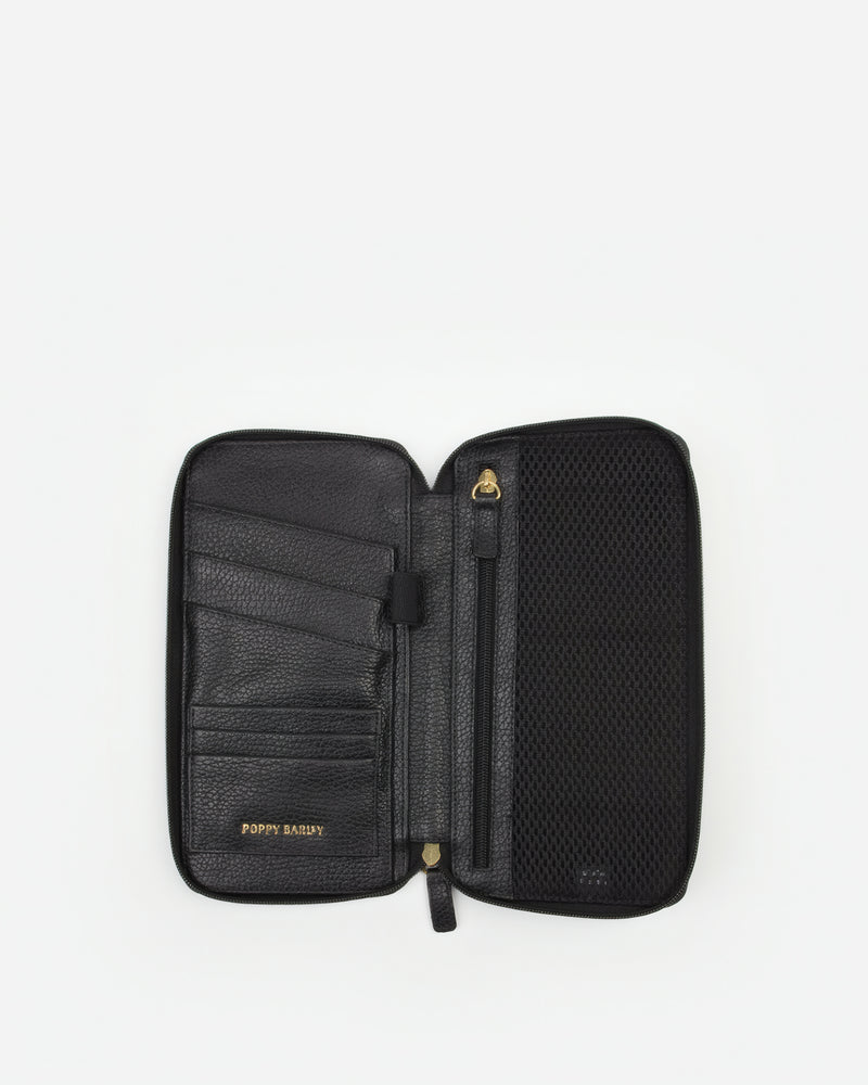 Front view of The Flying Solo Passport Holder Black Micro Pebble in pebbled leather