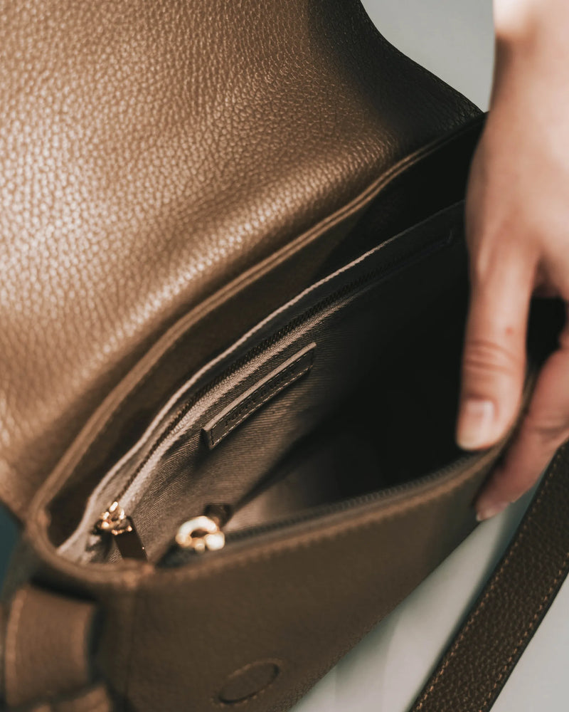 Interior of tapenade shoulder bag showing card slots and structured lining. The High Line Shoulder Bag Tapenade.