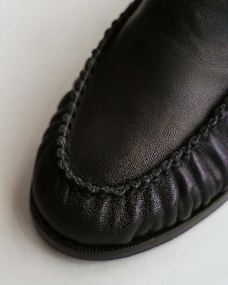 Close-up of leather loafer toe with ruched gathered detail. The Laid Back Loafer Black. Sizes 5–12, available in wide.