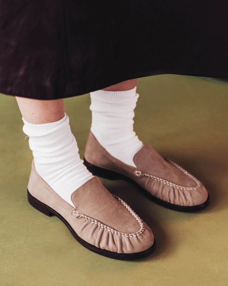 Loafers with slouchy white socks, dark skirt. The Laid Back Loafer Clay Nubuck. Sizes 5–12, available in wide.