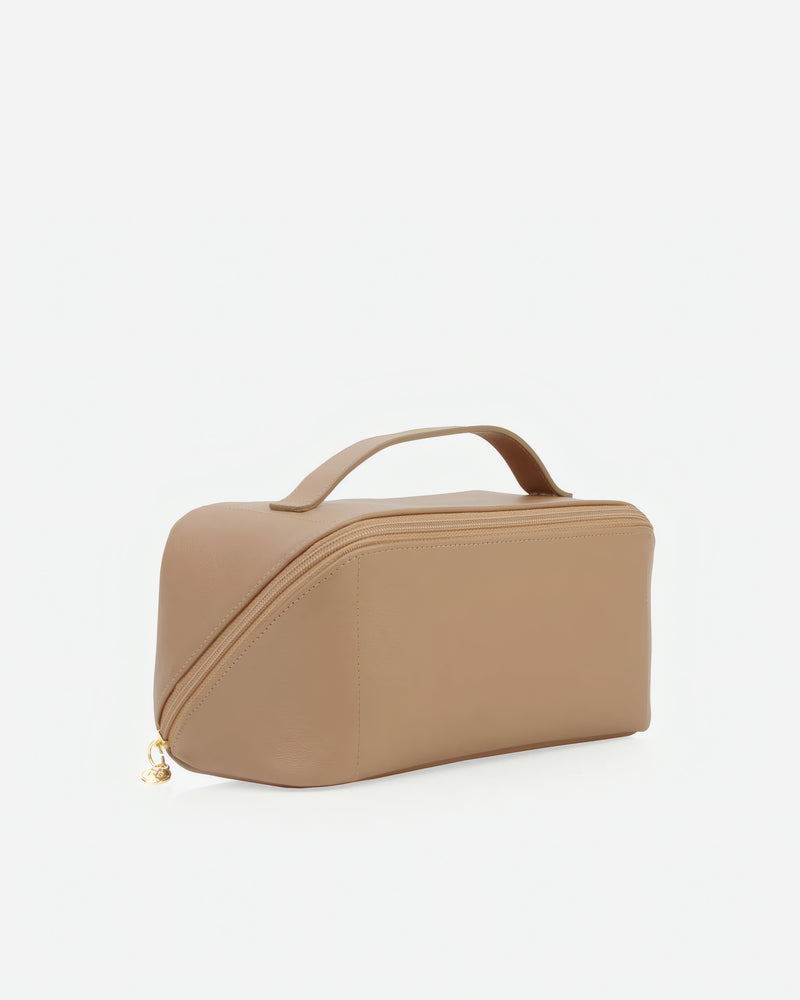 Angled view of The Cosmetic Case Large Biscotti in Neutral, Brown leather