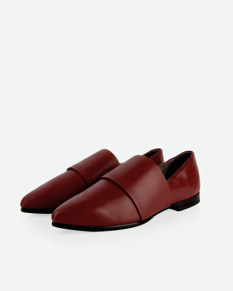 Pair of The Luxe Fit Flat Resort Red in Red smooth leather. Sizes 5–12