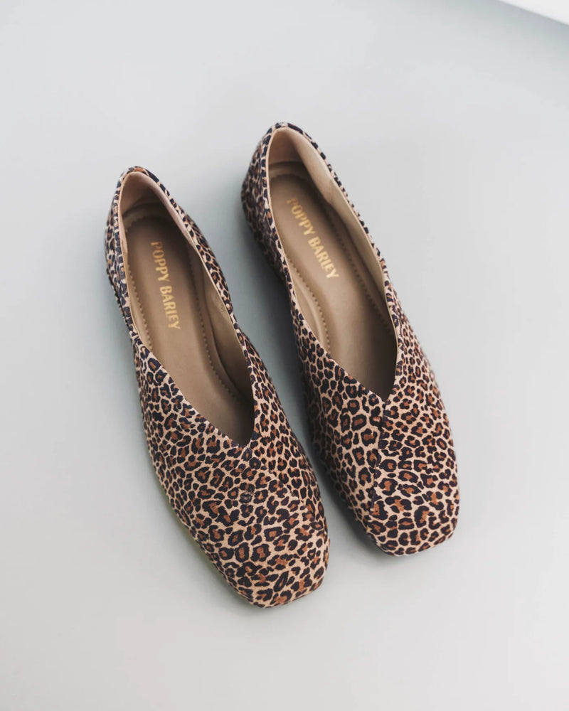 Square-toe flats overhead, insoles visible. The Marché Flat Micro Leopard. Sizes 5–12, available in wide.