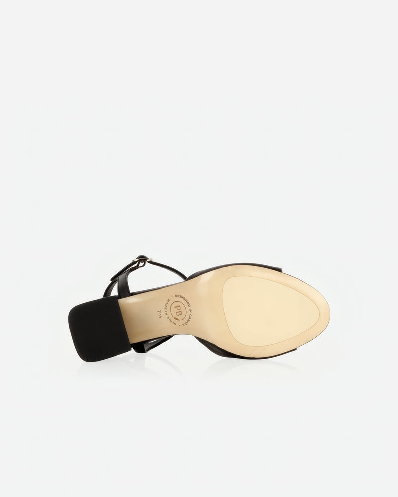 Heel detail of The Mila Heeled Sandal Black in smooth leather. Sizes 5–12