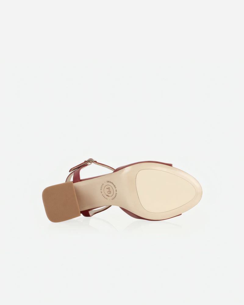 Heel detail of The Mila Heeled Sandal Rioja in Red smooth leather. Sizes 5–12