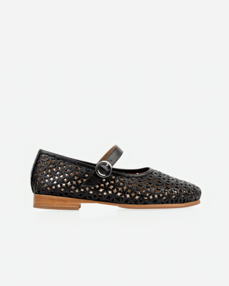 Side view of The Modern-Day Mary Jane Perforated Black in Black leather. Sizes 5–12, wide available