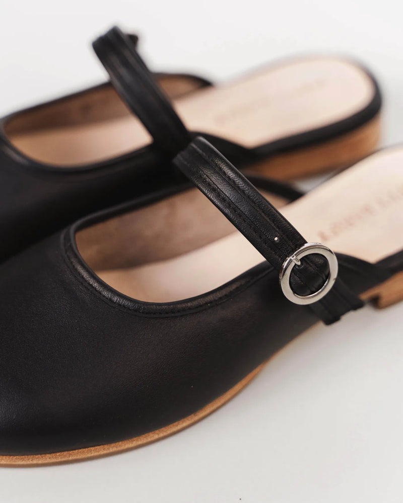 Leather mule with Mary Jane strap and silver buckle. The Modern-Day Mule Black. Sizes 5–12, available in wide.