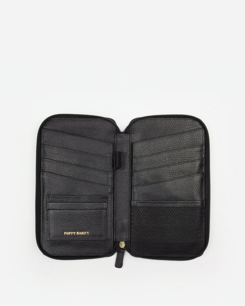 Front view of The Six Person Family Passport Holder Black Micro Pebble in pebbled leather