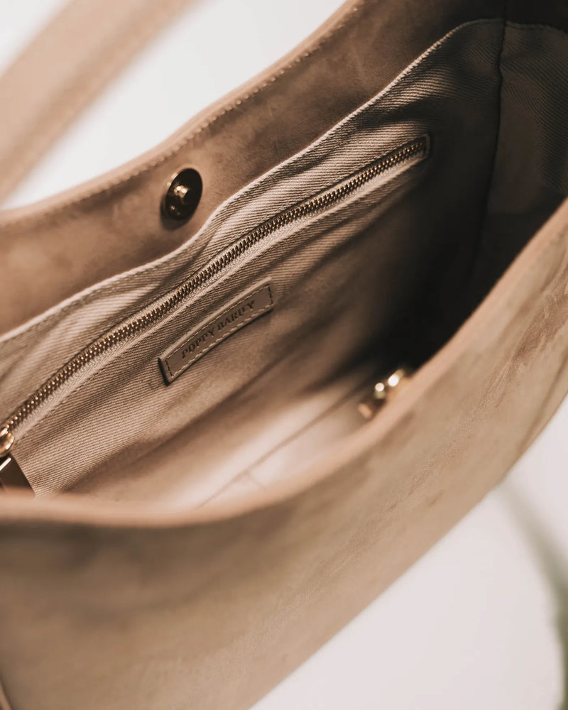 Nubuck tote open, showing beige fabric lining and interior zipper pocket. The Sixteenth Tote Clay.
