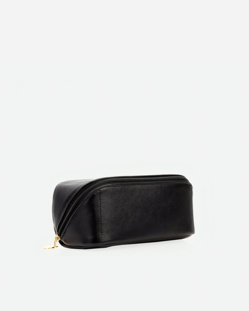 Angled view of The Cosmetic Case Small Black in leather