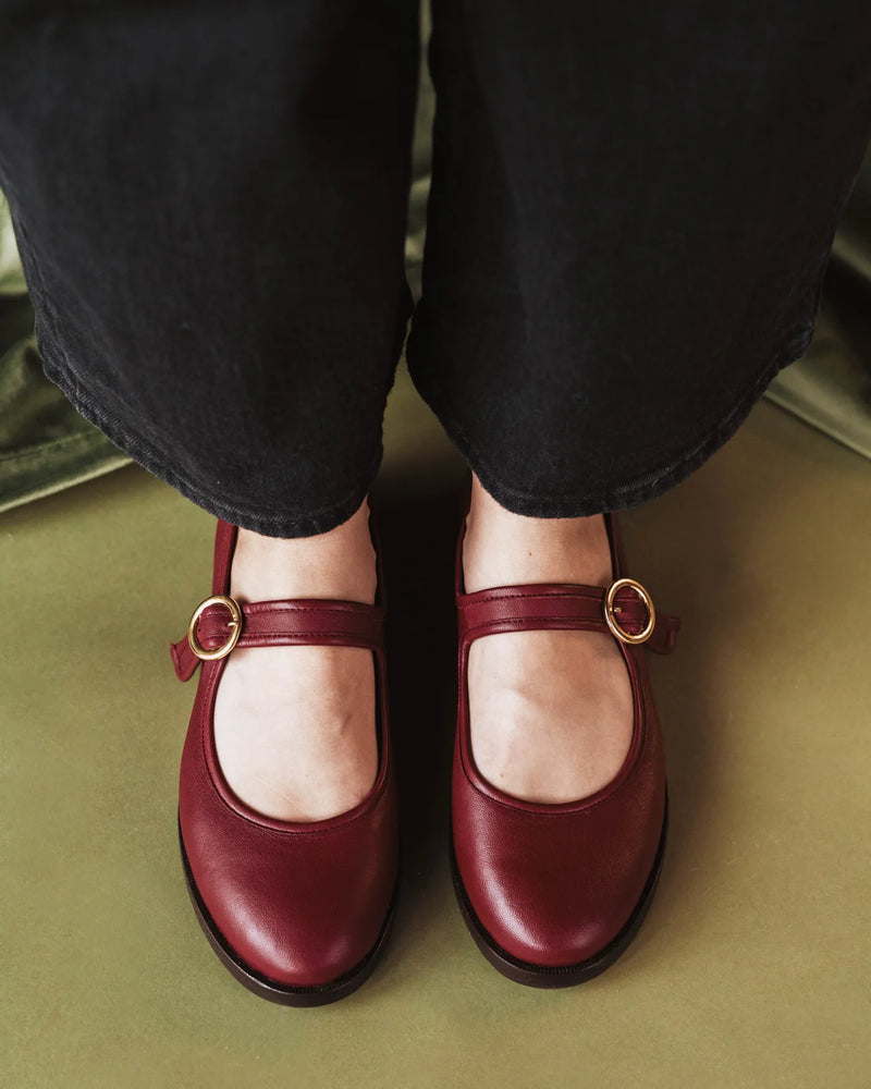 Overhead view of leather Mary Jane flats with gold buckle strap. The Today Mary Jane Resort Red. Sizes 5–12.