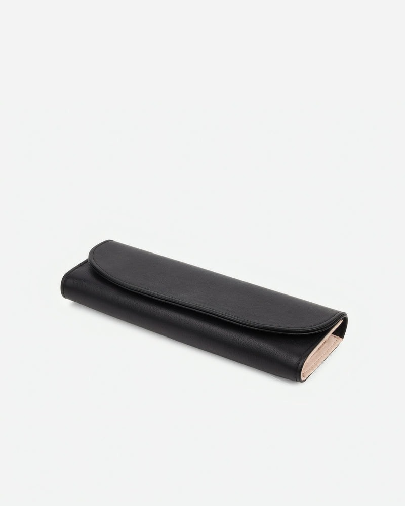 Angled view of The Travel Jewelry Case Black in leather