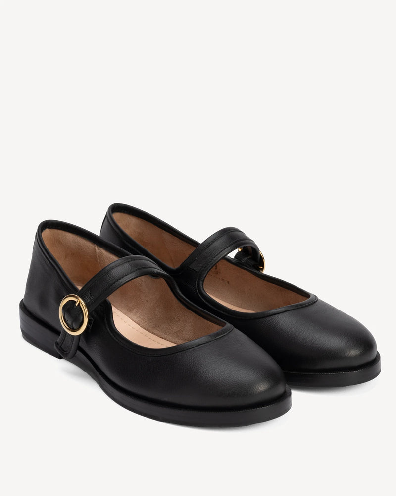 Angled pair of round-toe flats with single buckle strap. The Today Mary Jane Black. Sizes 5–12, wide available.
