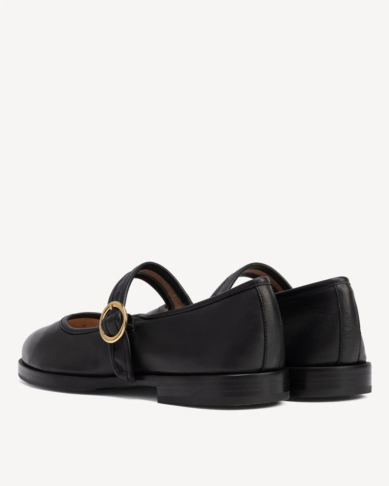 Back view showing single strap and buckle on round-toe flats. The Today Mary Jane Black. Sizes 5–12, wide available.