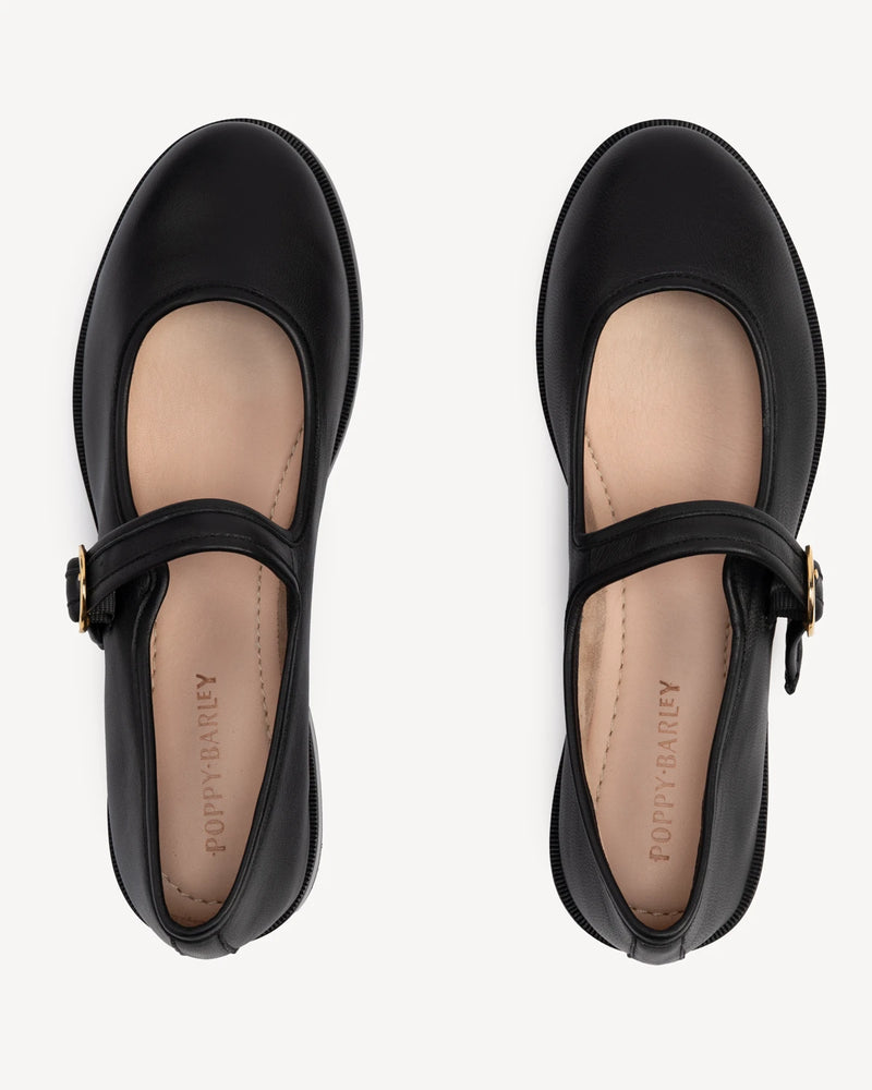 Overhead view of round-toe flats with single strap. The Today Mary Jane Black. Sizes 5–12, wide available.