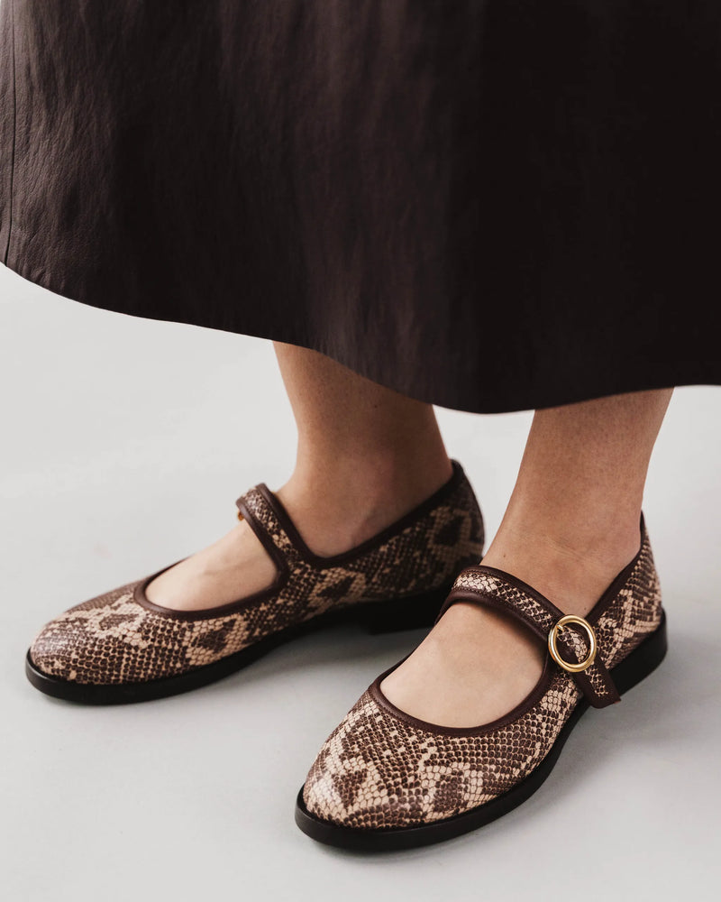 Print Mary Jane flats under a brown skirt. The Today Mary Jane Desert Snake. Sizes 5–12, available in wide.