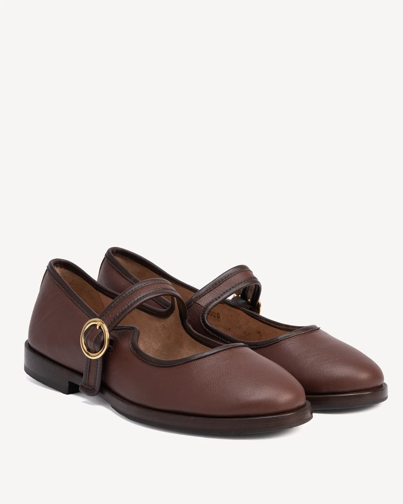 Angled pair of round-toe flats with single buckle strap. The Today Mary Jane French Press. Sizes 5–12.