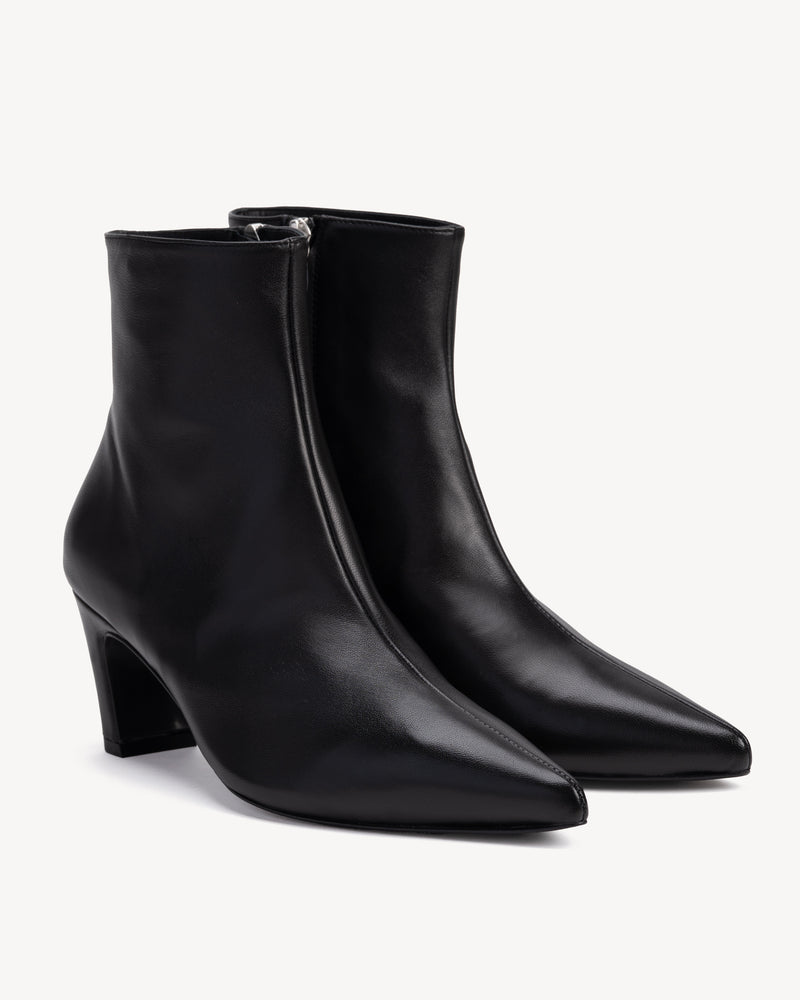 Angled view of The Toujours Boot Black in smooth leather. Sizes 5–12, wide available