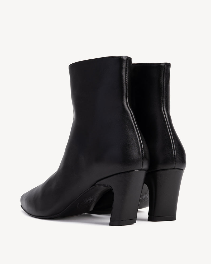 Back view of The Toujours Boot Black in smooth leather. Sizes 5–12, wide available