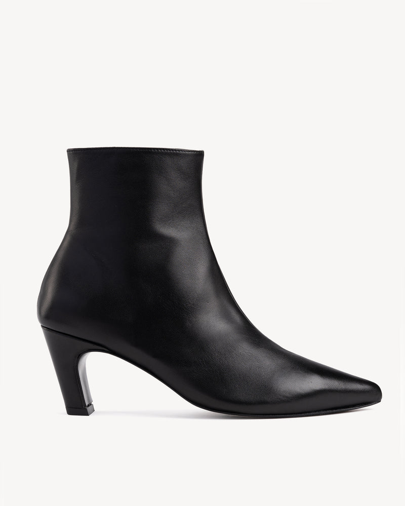 Side view of The Toujours Boot Black in smooth leather. Sizes 5–12, wide available