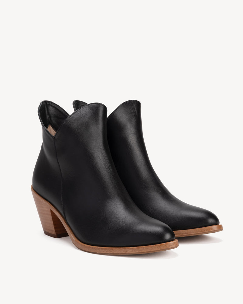 Angled view of The Two Point Five Ankle Boot Black Water Resistant in Black Tan. Sizes 5–12, wide available