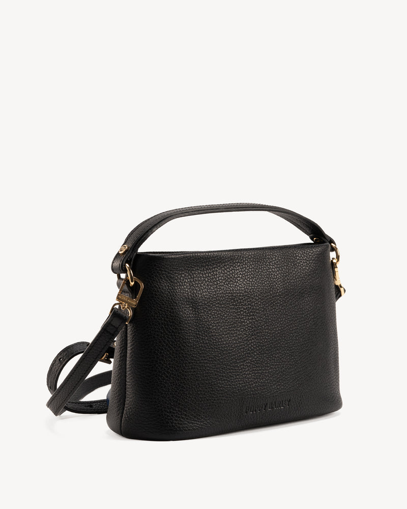 Angled view of The Via Monte Bag Black in leather