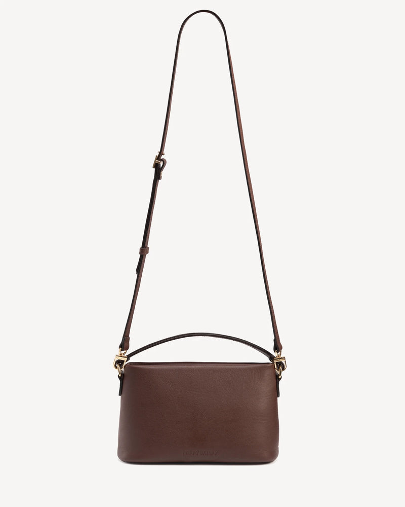 Rectangular crossbody bag with looped top handle and long adjustable strap. The Via Monte Bag French Press.