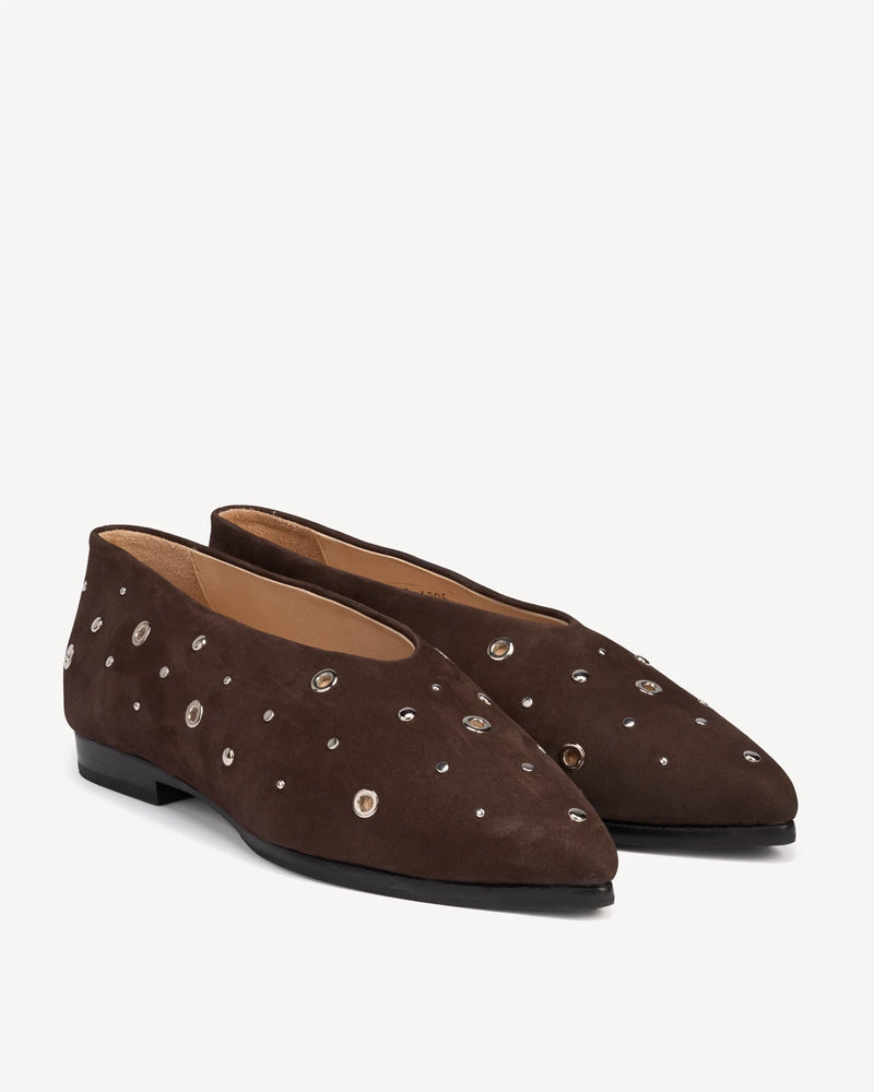 Pair of studded suede flats with pointed toes. The Atelier Flat Cocoa Plum Studded. Sizes 5–12, wide available.